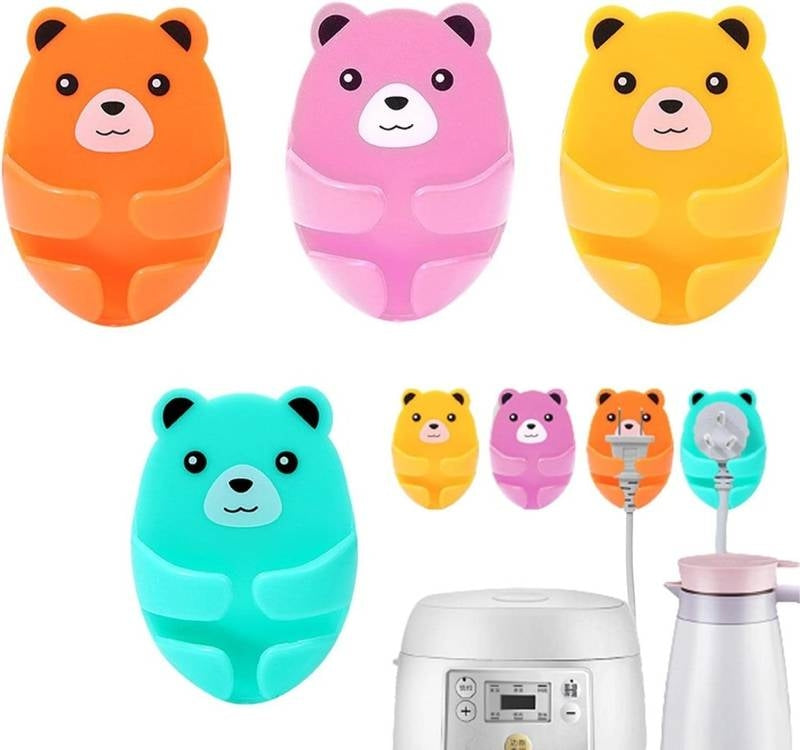 Set of colorful bear-shaped kitchen tools on a white background