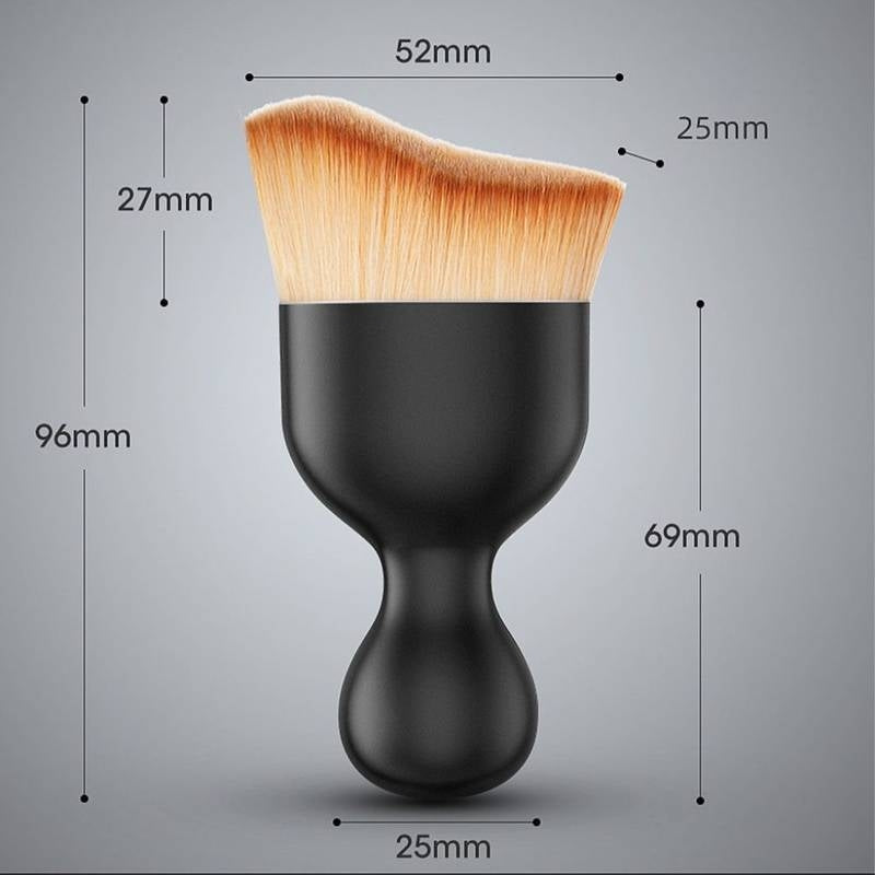 Makeup brush with measurements on a gray background