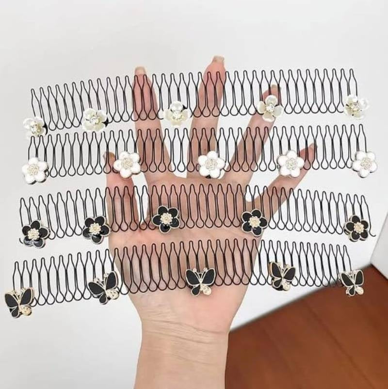 Hand holding a series of hair combs with decorative elements on a white background