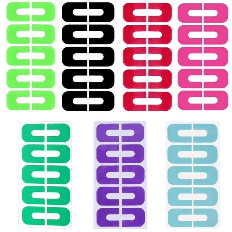 Set of colorful plastic clips in various colors on a white background