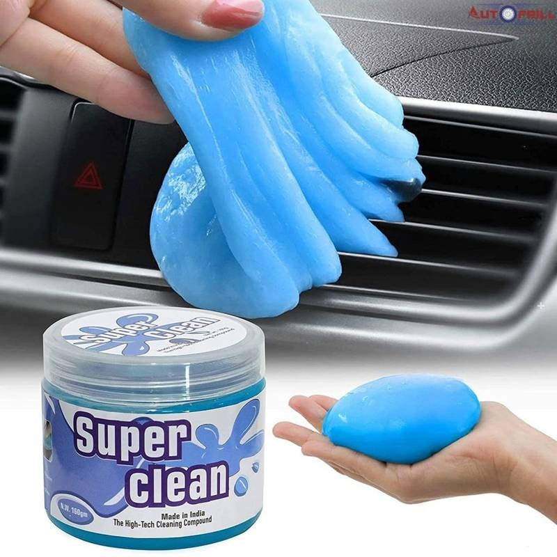 Blue cleaning gel being applied to a car's air vent with 'Super Clean' container shown.