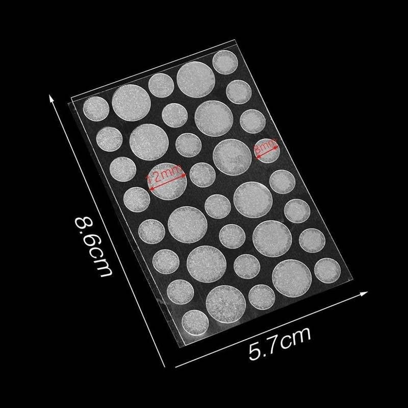 Sheet of round stickers with dimensions indicated on a black background