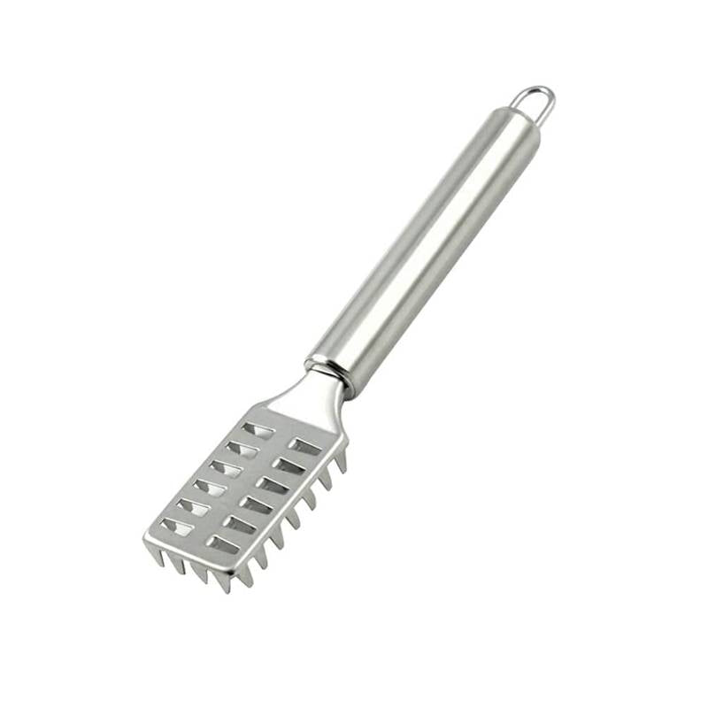 Metallic fish spatula on a white background