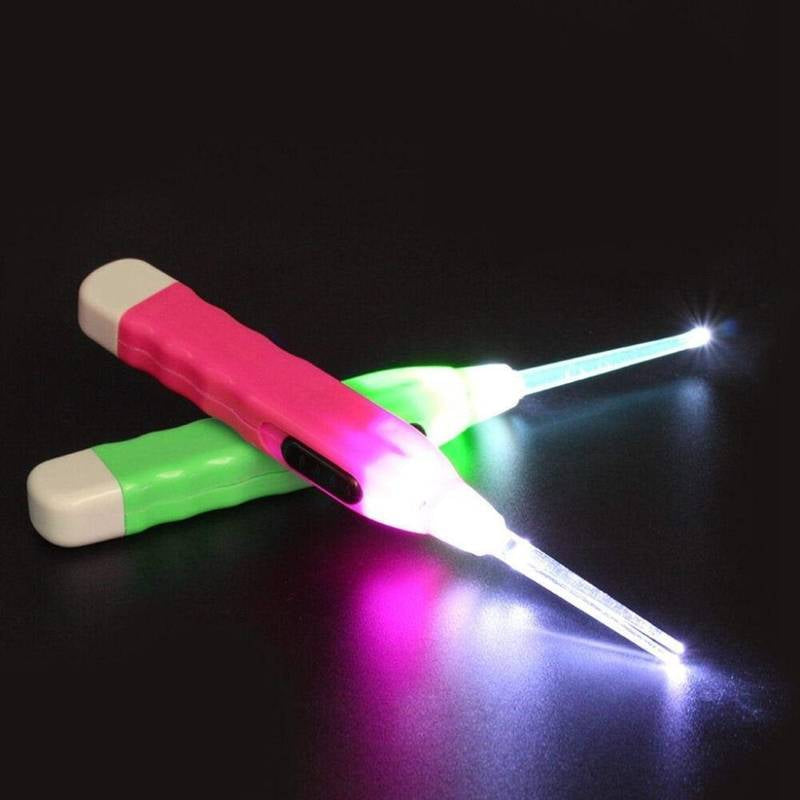 Two LED light sticks, one pink and one green, on a black background.