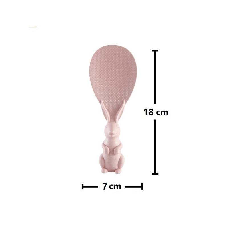 Pink rice paddle with measurements on a white background