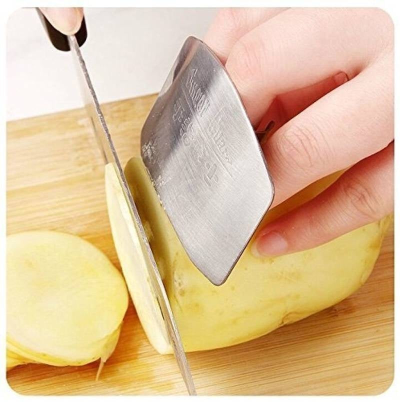 Knife sharpener being used on a knife with potatoes on a wooden cutting board.