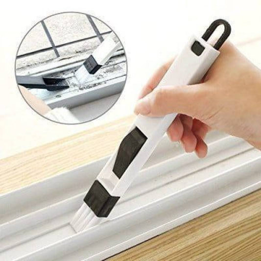 Person using a window cleaning tool to clean a window