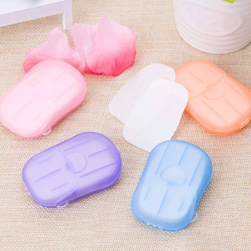 Colorful soap containers on a textured surface