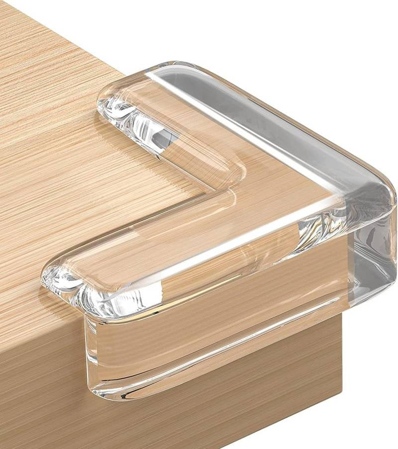Clear plastic corner protector on a wooden surface
