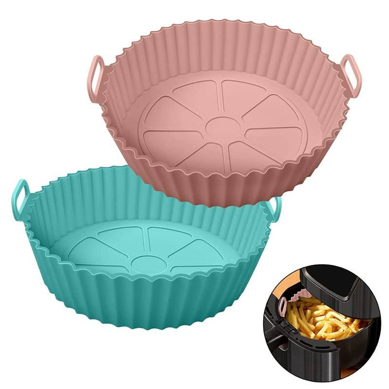 Two silicone baskets, one pink and one blue, with an inset showing their use in an air fryer.
