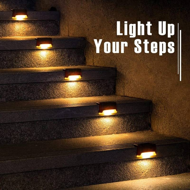 Stairs with embedded lights and text 'Light Up Your Steps' on a dark background