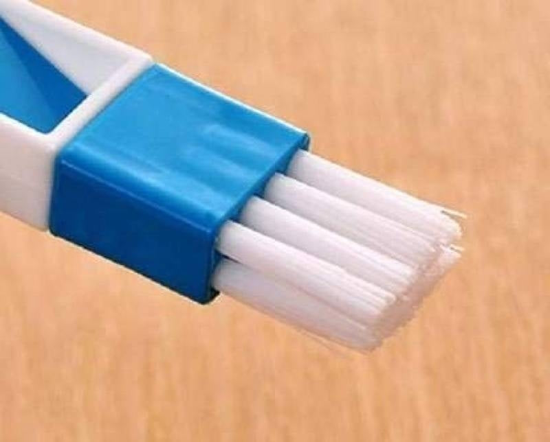 Blue and white brush on a wooden surface