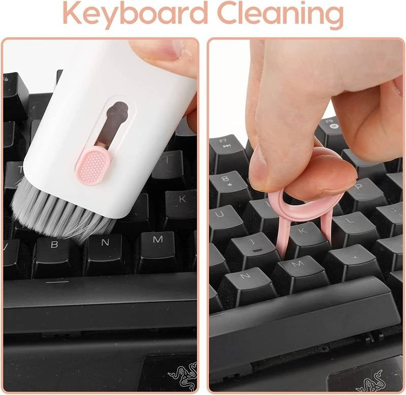 Keyboard cleaning process with a brush and keycap puller on a keyboard.