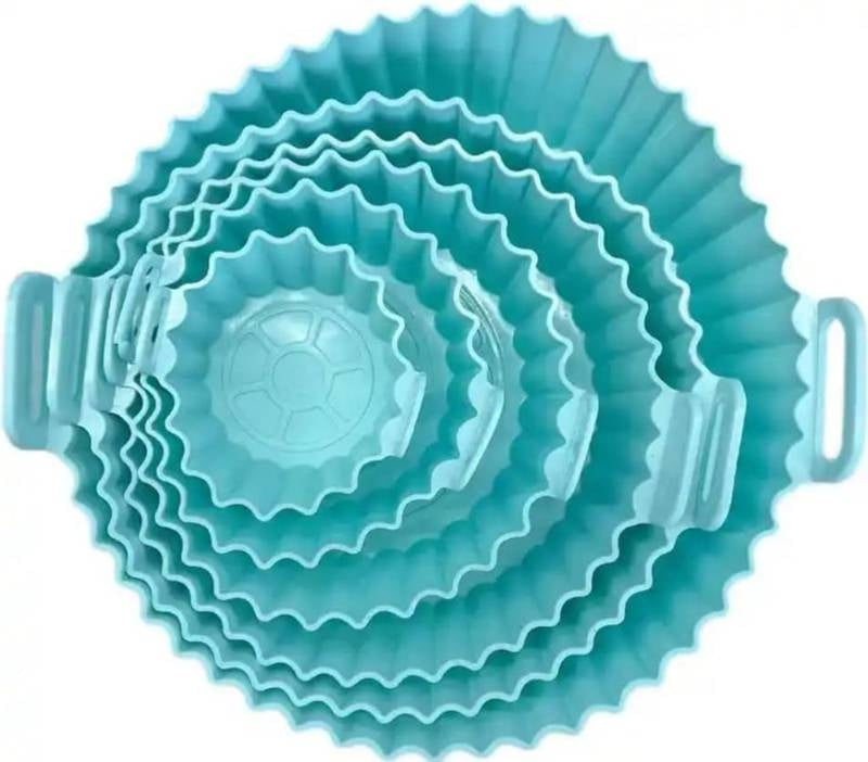 Set of blue silicone baking cups with handles on a white background