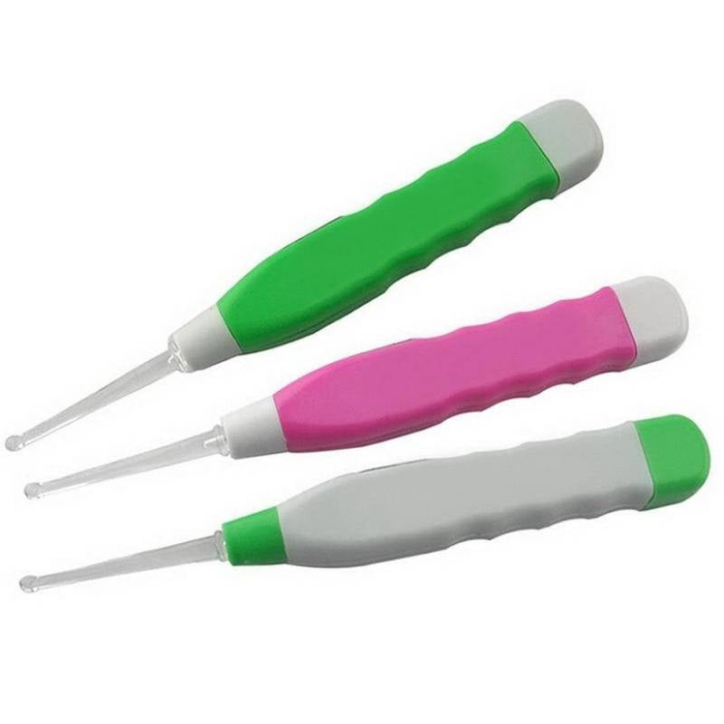 Three ear cleaning tools with green, pink, and white handles on a white background