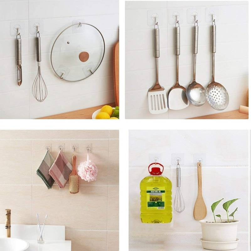 Set of kitchen utensils hanging on a wall with a plant and bottle in the background.